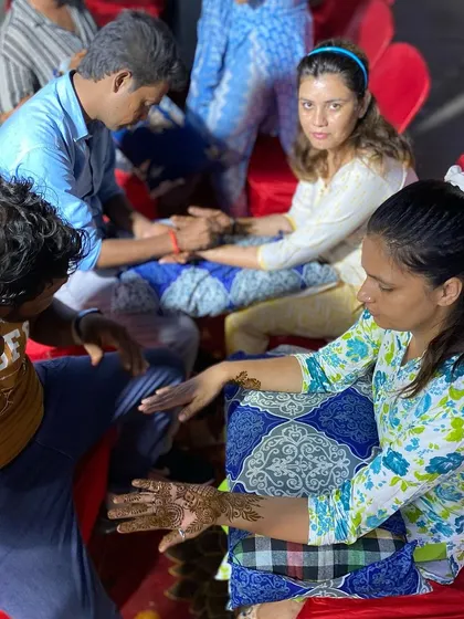 My artists applying mehandi for guests at an evening function. We set up to be comfortable and efficient, so everyone can get a design they love.