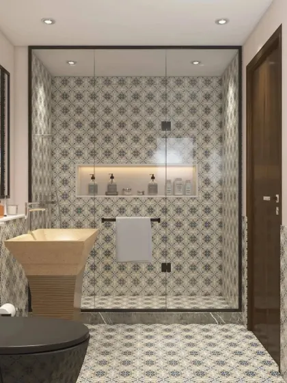This view highlights the walk-in shower with a glass partition and a built-in niche for toiletries.