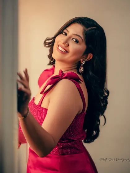 A beautiful smiling portrait, with makeup that enhances her natural features.