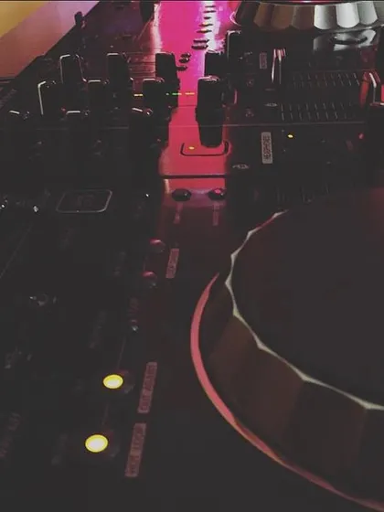 A close-up of my tools of the trade. The Pioneer DJ console is where all the magic happens, track by track, mix by mix.