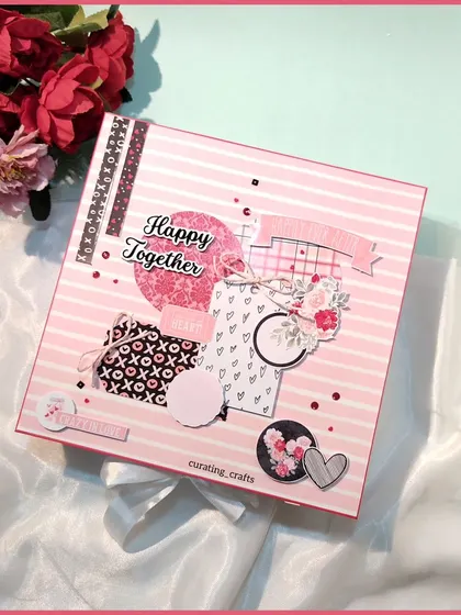 This anniversary scrapbook features a pink and black theme with "Happy Together" on the cover. It’s a sweet and modern design for a happy couple.