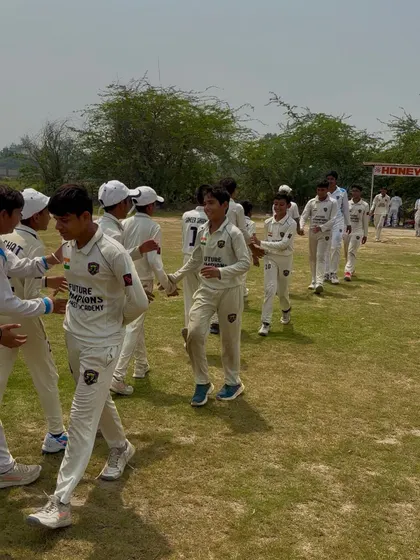 The winning team walking off the field, proud of their achievement.