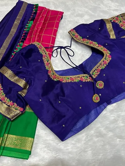 Pink, green, and blue with a golden whisper. This saree tells a story you wear.