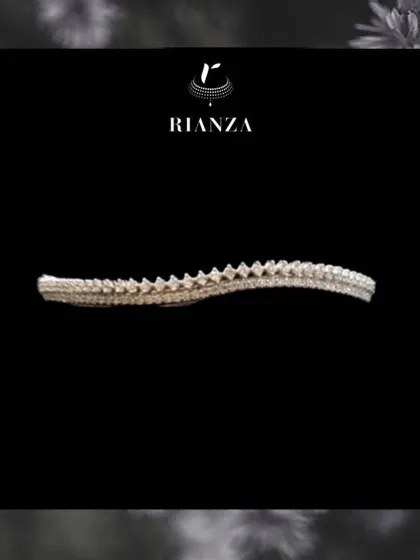 This minimal diamond wristlet features a unique, textured design. It's the perfect pick if you want a piece that is both simple and elegant enough for any outfit.