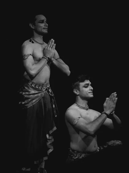 A black and white shot of Adithya PV and me in 'ATAH', capturing a moment of prayerful stillness.