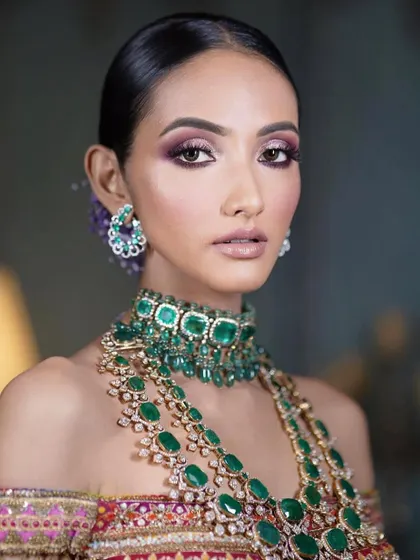 A modern bridal look with a purple smokey eye. This is a great example of how to incorporate color into bridal makeup in a sophisticated and elegant way.