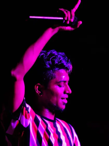 A candid shot from the Ajeet Fest, feeling the music under the pink stage lights.