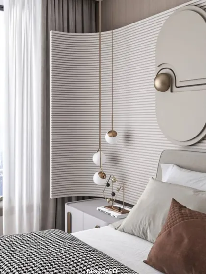 A close-up on the bedside details, showing the unique curved and fluted wall panel, geometric wall art, and delicate pendant lighting that add layers of sophistication.