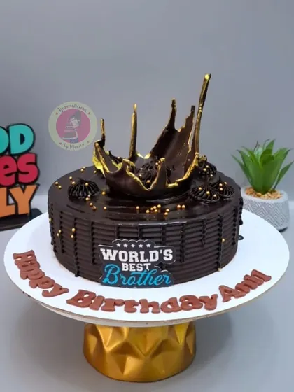A rich chocolate cake for the "World's Best Brother," topped with a dramatic chocolate splash.