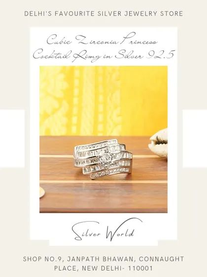 A glamorous princess cocktail ring featuring layers of baguette-cut zirconia. The architectural design gives it a modern and sophisticated feel.