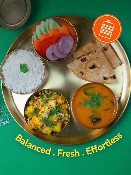 Balanced. Fresh. Effortless. This thali with pumpkin sabzi, sambar, rice, roti, and salad perfectly sums up my food philosophy.