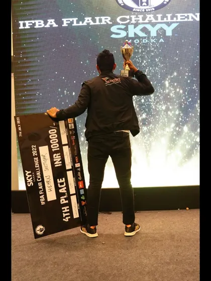 A victory pose from our award-winning bartender, celebrating his win at the IFBA Flair Challenge.
