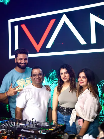 Posing with fans in front of my custom branding. It's all about creating a memorable experience.