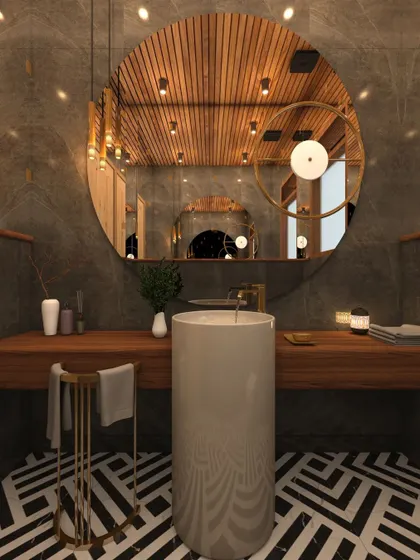 The bathroom features a freestanding cylindrical sink on a wooden vanity, a large circular mirror, and dramatic geometric floor tiles.
