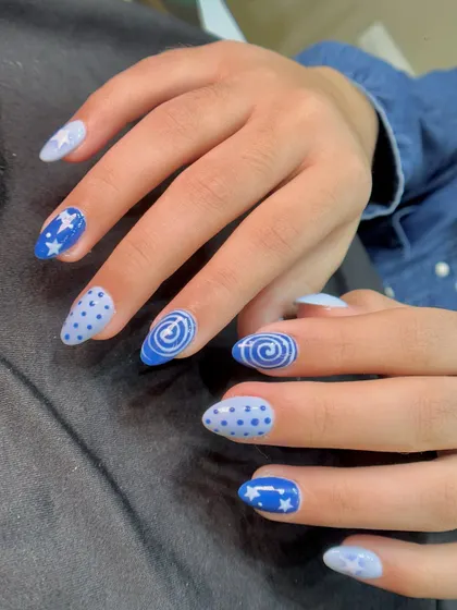 For a fun and playful look, I created this mix-and-match blue set. It features hand-painted stars, polka dots, and swirls, showing how different patterns can come together for a cohesive and creative style.