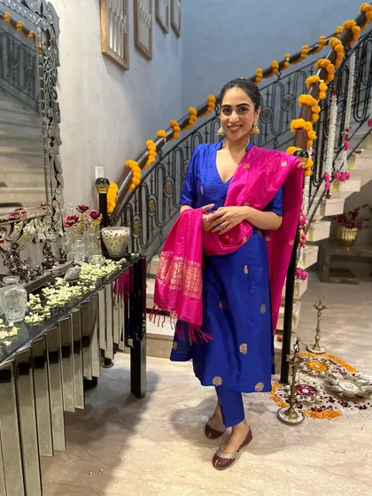 A classic blue and pink suit, perfect for Diwali puja. The bright colors and traditional silhouette are timeless.