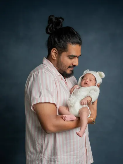A father's gentle gaze. I love capturing the look of pure adoration on a dad's face as he holds his tiny baby.