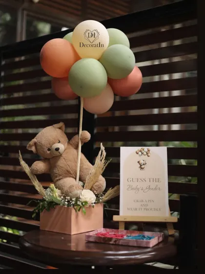 A "Guess the Baby's Gender" station, where guests can grab a pink or blue pin to wear.
