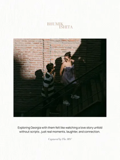 A candid moment captured on a staircase, with strong shadows creating a dramatic effect. The text overlay emphasizes the unscripted nature of their story unfolding in Georgia.