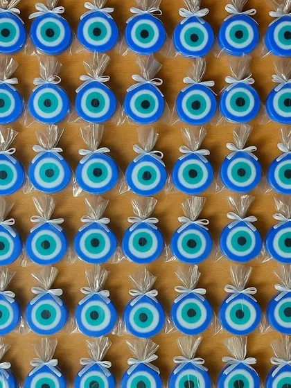 A grid of my evil eye soaps, individually wrapped and ready to be gifted as tokens of protection.