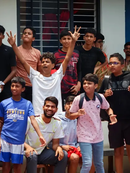 The crowd of young players cheers on their peers. The energy and support from the sidelines is a huge part of the JBL experience.