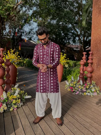 Let's bring some new colors to life. This maroon kurta adds a touch of richness and is perfect for a festive occasion.