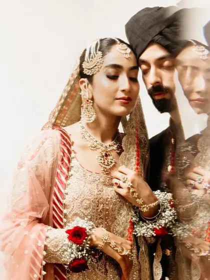 An artistic portrait using in-camera blur and layering. This technique creates a soft, dreamy, and ethereal image that focuses on the quiet, emotional connection between the bride and groom.