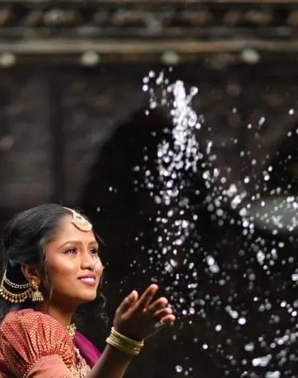 A stunning shot from the photoshoot, capturing a moment of joy. The makeup is designed to look beautiful even in dynamic, action shots.