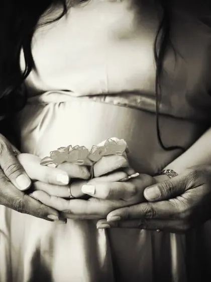 A timeless black and white version of our popular baby shoes announcement shot. This classic edit adds an extra layer of emotion and artistry to the image.
