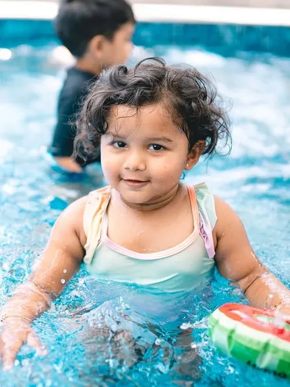 A happy splash in the pool. Event photography is about capturing all aspects of the celebration, including the fun and playful moments like this.