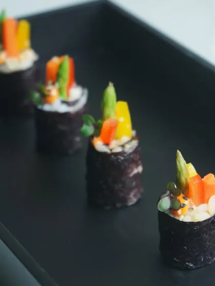Vegetarian sushi rolls filled with crisp asparagus and colorful bell peppers. These are a popular choice for guests looking for a light, healthy, and flavorful canapé option.