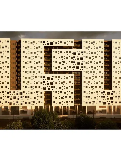 A work-in-progress view of an affordable housing project. The facade is defined by a distinct fenestration pattern of varied squares, creating visual interest while adhering to the efficiencies required for low-cost community housing.
