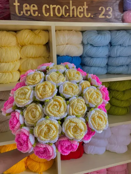 Another custom rose bouquet, this one featuring yellow, white, and pink blooms.