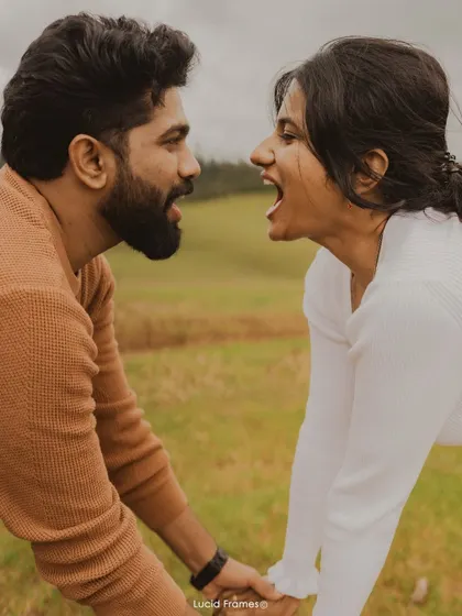 A fun, playful moment of the couple roaring at each other, showing that love is also about being silly together.