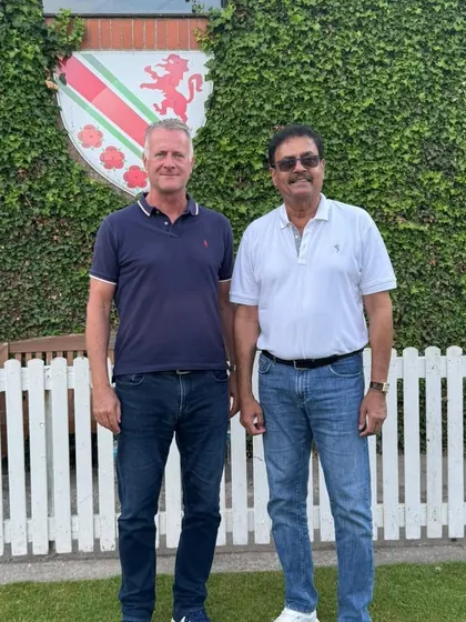 With the president of the Urmstone Cricket Club, John Marshall. Building strong relationships with club leadership is key to a successful tour.