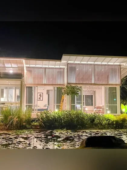 The home's expansive glass walls create a direct visual connection to the lily pond. From inside, it feels as though the house is floating on the water, fully immersed in the natural landscape we created.