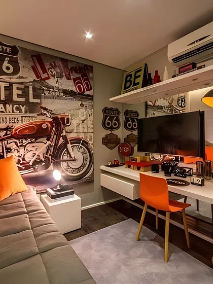 This bedroom is designed with a vintage motorcycle theme, featuring a large "Route 66" wall mural. The industrial-style lighting and pops of orange create a bold, personalized space perfect for any enthusiast.