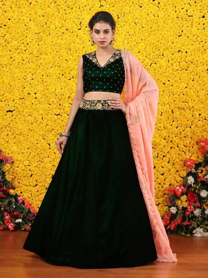 Another full view of the green velvet lehenga, emphasizing its rich texture and elegant drape.