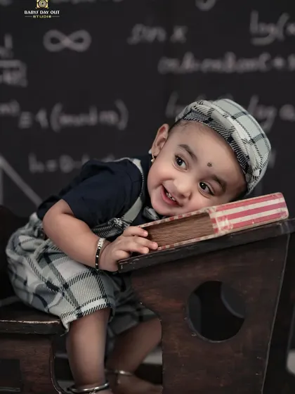 A sleepy little student taking a nap on his desk. We capture the funny and adorable moments of our themed shoots.