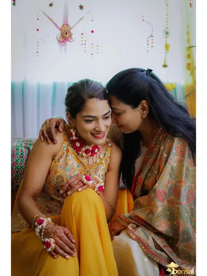 An emotional and tender moment between the bride and her mother during the Haldi.