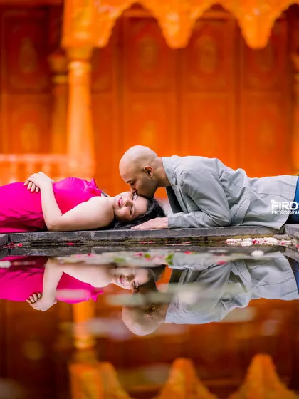 This is one of my favorite creative shots, using a water reflection to create a serene and artistic maternity portrait. The gentle kiss and the perfect reflection in the water capture a quiet, intimate moment between the couple.