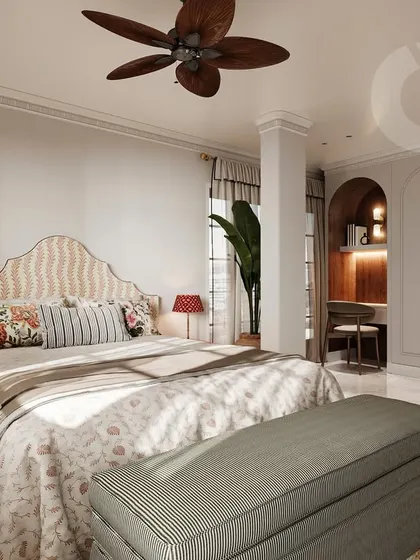 This view of the bedroom showcases the balance of minimalism and thoughtful accents. The patterned headboard and colorful bedside lamps add personality, while the arched niche reveals a modern study area, blending beauty with practicality.