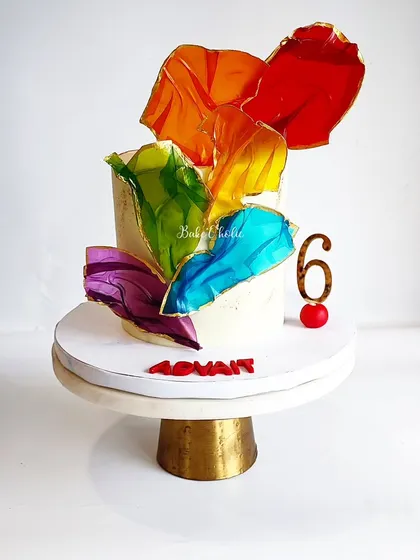 A cake for a paint-themed party, featuring colorful rice paper sails. This simple technique creates a stunning, artistic effect that really stands out.