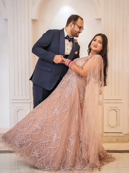 A playful and romantic shot of the groom dipping the bride during their engagement photoshoot.