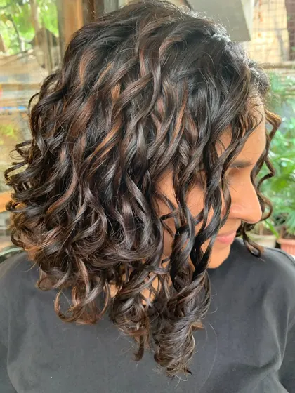 A happy bride with her new curly hair. The cut and color are so flattering and romantic. (No filter)