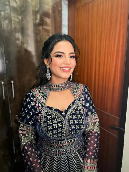 Heer's sangeet look was all about celebrating with color. The pop of pink on her lips adds a fun and festive touch.