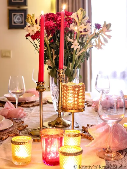 The interplay of red, pink, and gold on this Diwali table feels so rich and festive.