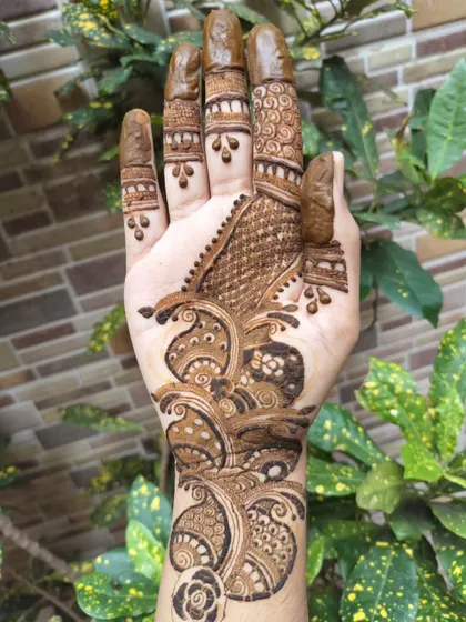 A closer look at a student's Arabic mehndi work. You can see the clean lines and confident strokes in the paisley and floral elements, which are key characteristics of this style.