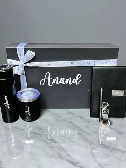 The best gifts are personal. This custom hamper, created for 'Anand', includes a personalized flask, tumbler, and journal, showing how I add a unique touch to make someone feel truly special.