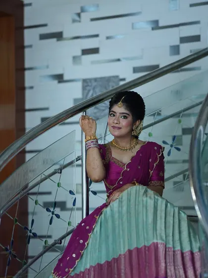 Nothing makes me happier than dressing sisters for their special moments. I designed these matching turquoise and purple Langa Voni outfits for a half saree function, ensuring they both looked coordinated yet unique.